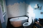 bathroom with shower and tub